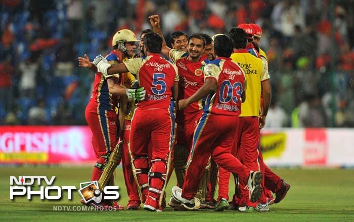 T20 is about runs and wickets and more runs. Bangalore's win off the last ball against Pune had all of it with a dash of celebrity-induced glitz and a power-packed end. A look. (AFP PHOTO/Manjunath KIRAN) IPL 5: Bangalore down Pune in a thriller