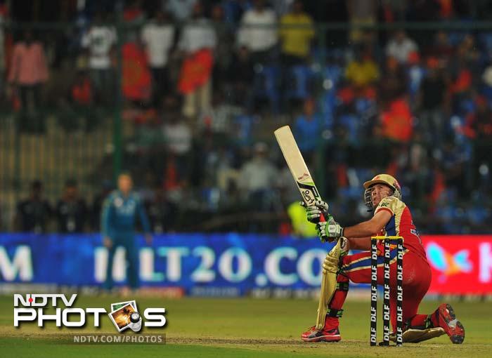 It was left to AB de Villiers' unorthodox yet effective style which brought thwe match to the final over with a chance of a win still left, albeit dim. (AFP PHOTO/Manjunath KIRAN) IPL 5: Bangalore down Pune in a thriller