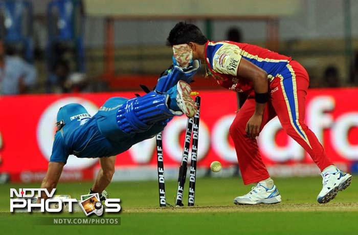 When Uthappa was finally removed, the batting was powered by Steven Smith (seen diving here) and Marlon Samuels. The visitors eventually managed to set a target of 183. (AFP PHOTO/Manjunath KIRAN) IPL 5: Bangalore down Pune in a thriller