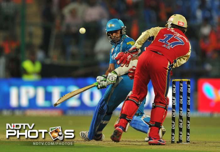 Robin Uthappa punched almost every bowler who came at him and scored a splendid 69 off 45 which had nine boundaries and two sixes. (AFP PHOTO/Manjunath KIRAN) IPL 5: Bangalore down Pune in a thriller