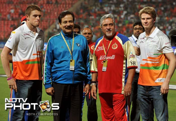 The Sahara Force India drivers were also present and said that though their stakeholders may have different cricket teams, the drivers are opting to remain neutral. (AFP PHOTO/Manjunath KIRAN) IPL 5: Bangalore down Pune in a thriller