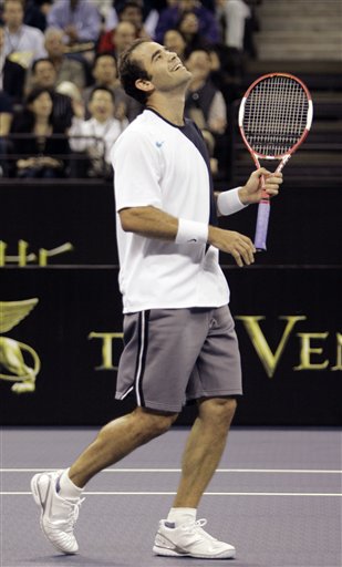 Pete Sampras gestures during the friendly match against Roger Federer in Macau. Sampras stuns Roger