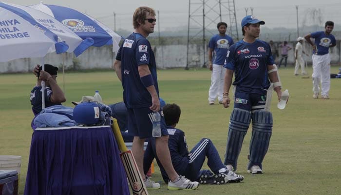 Jonty Rhodes and Sachin Tendulkar look on as others slog it out in practice. CLT20: Sachin Tendulkar and Mumbai Indians start preparations ahead of tournament