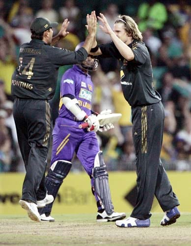Nathan Bracken, right, celebrates with his captain Ricky Ponting, left, after Sri Lanka's Kumar Sangakkara, center was trapped LBW for 42 runs by Bracken at the Sydney Cricket Ground on Friday, February 8, 2008 during their one day international cricket match. Australia made 253 in their innings. 3rd Match: Aus-Lanka