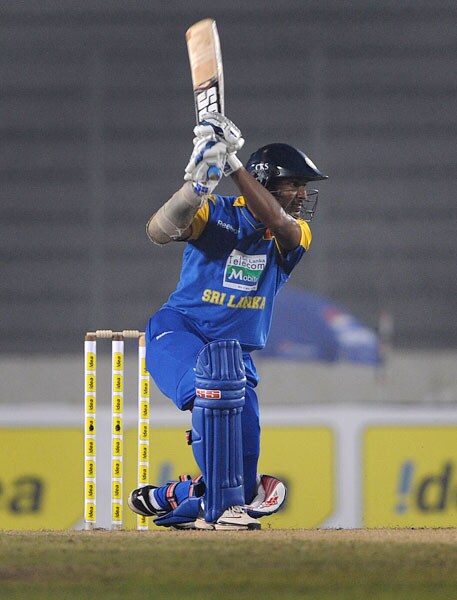 Sri Lanka's Kumar Sangakkara plays a shot against Bangladesh during their first One-Day International of the tri-series in Dhaka. (AFP Photo) 1st ODI: SL vs B'desh