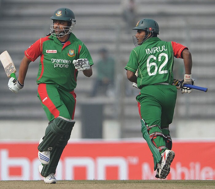 Bangladeshi cricketers Tamim Iqbal and Imrul Kayes take a run against Sri Lanka during their first One-Day International of the tri-series in Dhaka. (AFP Photo) 1st ODI: SL vs B'desh
