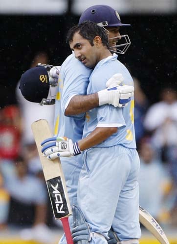 Gautam Gambhir, right, is embraced by his captain MS Dhoni after scoring a century against Sri Lanka in a One-Day cricket international in Brisbane on Tuesday, February 5, 2008. 2nd Match: India-Lanka