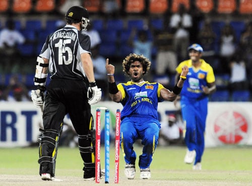Sri Lanka's Lasith Malinga celebrates the dismissal of New Zealand's Nathan McCullum during the first ODI of the Tri-Nation Championship trophy in Colombo. (AFP Photo) Tri-series: SL vs NZ
