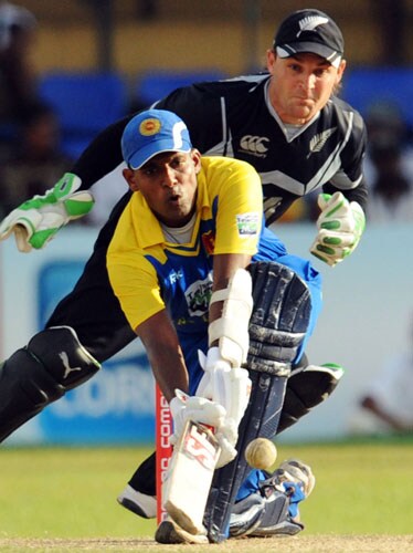 Sri Lanka's Thilan Samaraweera bats as New Zealand's wicketkeeper Brendon McCullum looks on during the first ODI of the Tri-Nation Championship trophy in Colombo. (AFP Photo) Tri-series: SL vs NZ