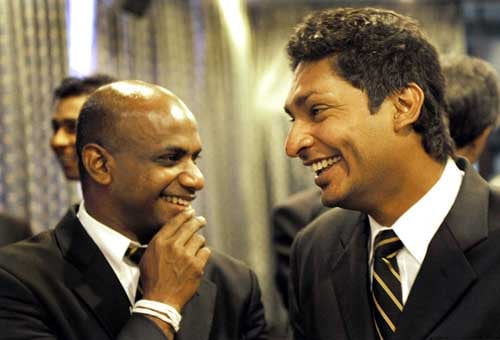 Sanath Jayasuriya shares a light moment with captain Kumar Sangakkara, during a religious ceremony in Colombo before leaving for England to play in the ICC Twenty20 World Cup. (AFP Photo) Sri Lankans leave for T20 WC