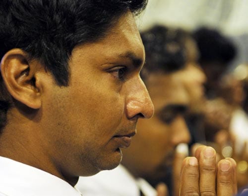 Kumar Sangakkara is blessed by a Buddhist monk in Colombo before leaving for England to play in the ICC Twenty20 World Cup. (AFP Photo) Sri Lankans leave for T20 WC