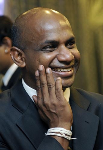 Sanath Jayasuriya smiles during a religious ceremony in Colombo before leaving for England to play in the ICC Twenty20 World Cup. (AFP Photo) Sri Lankans leave for T20 WC