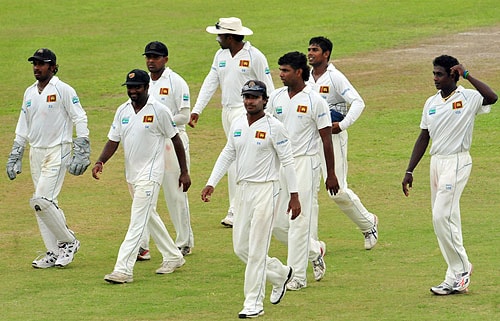 Sri Lankan cricketers are led by captain Kumar Sangakkara as they leave the pitch at the end of the third day of the first Test match between Sri Lanka and New Zealand at The Galle International Cricket Stadium on August 20, 2009. At stumps New Zealand had advanced to 281 runs for the loss of eight wickets in their first innings. (AFP Photo) SL vs NZ: 1st Test, Day 3