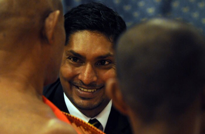 Sri Lankan Buddhist monk ties a blessed white thread around national cricket team captain Kumar Sangakkara's wrist during a religious ceremony at the Sri Lanka Cricket headquarters in Colombo. (AFP Photo) Sri Lankan team leaves for the Caribbean