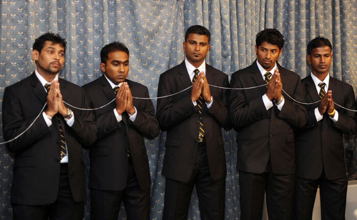 Team members Tillakaratne Dilshan (L), Mahela Jayawardena (2nd L), Chinthaka Jayasinghe (C), Chanaka Welegedara (2nd R), and Nuwan Kulasekera (R) observe Buddhist rituals ahead of their departure for the Carribean. (AFP Photo) Sri Lankan team leaves for the Caribbean