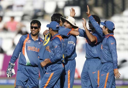India's Harbhajan Singh and Rohit Sharma celebrate the wicket of New Zealand's Jacob Oram during a warm up match at Lord's in London on Monday. (AFP Photo) India vs NZ warm-up match