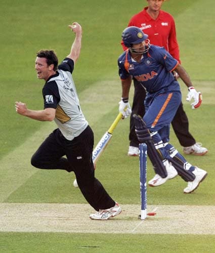 New Zealand's Ian Butler celebrates after running out India's Irfan Pathan during the Twenty20 World Cup warm-up match between India and New Zealand at Lord's cricket ground in London on Monday. (AP Photo) India vs NZ warm-up match