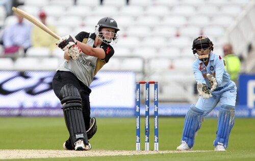 Aimee Watkins hits out against India as wicketkeeper Priyanka Roy looks on during their ICC World Twenty20 Women's semi-final match at Trent Bridge. (AP Photo) WT20: NZ vs IND