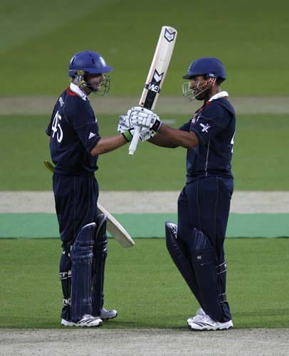 Luke Wright of England congratulates Ravi Bopara of England on reaching 50 runs against West Indies during their Twenty20 match prior to the start of the ICC World Twenty20 at Lord's cricket ground in London, on Wednesday. (AFP Photo) Eng vs WI warm-up match