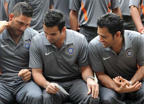Zaheer Khan and MS Dhoni listen to teammate Yuvraj Singh at the official team photo opportunity in Mumbai. (AFP Photo) Confident India leave for T20 WC