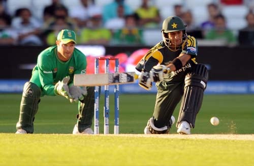 Pakistan's batsman Shoaib Malik sweeps the ball away from South Africa's wicket keeper Mark Boucher during a warm-up match at Trent Bridge in Nottingham, England on Monday. (AFP Photo) Pak vs SA warm-up match