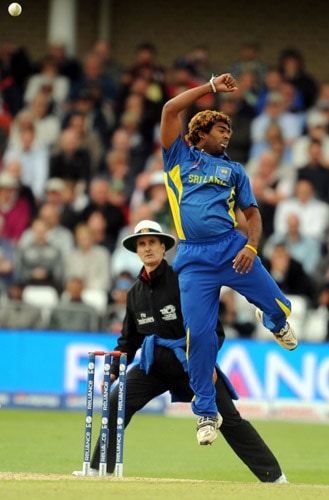 Lasith Malinga jumps to catch an Australian shot during the World Twenty20 match at Trent Bridge cricket ground in Nottingham. (AFP Photo) WT20: AUS vs SL