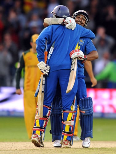 Kumar Sangakkara embraces Jehan Mubarak as they celebrate beating Australia in the World Twenty20 match at Trent Bridge in Nottingham. (AFP Photo) WT20: AUS vs SL
