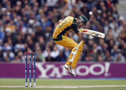 Michael Clarke of Australia avoids a bouncer from Jerome Taylor during their ICC World Twenty20 match against the West Indies at The Oval in London. (AFP Photo) WT20: AUS vs WI
