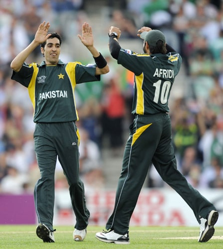 Umer Gul celebrates with teammate Shahid Afridi after bowling Trent Johnston for a duck during an ICC World Twenty20 match at the Oval in London. (AFP Photo) WT20: PAK vs IRE