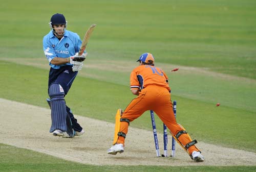 Scotland's Kyle Coetzer turns to see the bales knocked off by Netherland's wicket keeper Jeroen Smits during an ICC World Twenty20 World Cup warm-up match at the Oval, in London, on Wednesday. (AFP Photo) NED vs SCO warm-up match