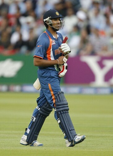 Rohit Sharma walks back to the dugout after getting out against the West Indies during the ICC World Twenty20 match at Lord's in London. (AFP Photo) WT20: IND vs WI