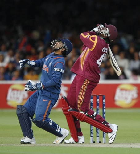 Chris Gayle caught out with this shot watched by MS Dhoni during the ICC World Twenty20 match at Lord's in London. (AFP Photo) WT20: IND vs WI