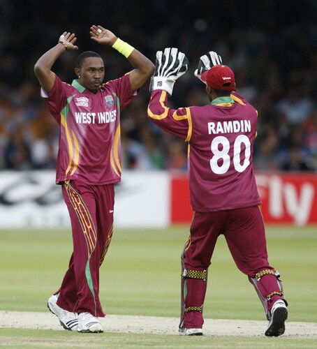 Dwayne Bravo celebrates the wicket of Yusuf Pathan during the ICC World Twenty20 match at Lord's in London. (AFP Photo) WT20: IND vs WI