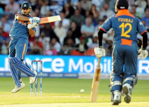 Mahendra Singh Dhoni plays a shot during the Super Eight stage of the ICC World Twenty 20 match against South Africa at Trent Bridge on June 16, 2009. (AFP Photo) WT20: IND vs SA