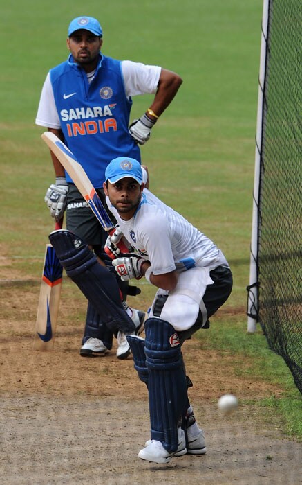 Indian cricketer Virat Kohli (R) is watched by teammate Murali Vijay as he bats during a training session.(AFP Photo) Ind vs Aus 3rd ODI: Teams' training session