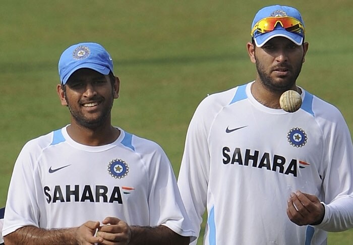 Indian cricket captain Mahendra Singh Dhoni (L) and teammate Yuvraj Singh share a light moment during a training session. (AFP Photo) Ind vs Aus 3rd ODI: Teams' training session