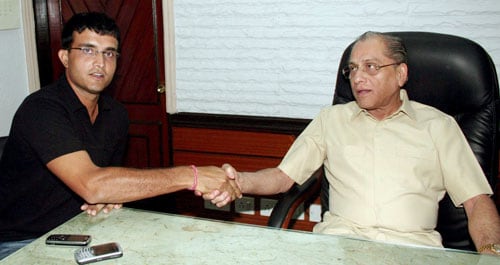 Cricketer Sourav Ganguly shakes hands with CAB President Jogmohan Dalmiya at CAB office after his selection for the first two Tests against Australia in Kolkata. Team selection for Australia series