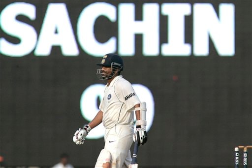 Sachin Tendulkar walks in front of a giant screen before making a century during the fifth day of the first Test cricket match between India and England in Chennai on Monday, December 15, 2008. (AP Photo) Tendulkar's way to 41st ton