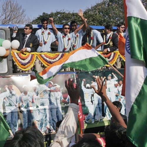 Members of the India Under-19 cricket team go around Bangalore in an open-top bus after they landed in India. They had won the U-19 World Cup in Kuala Lumpur on Sunday. India Under-19 Celebrations