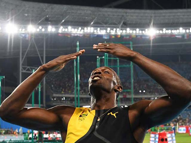 Photo : Usain Bolt Clinches Hat-Trick Of 100m Golds