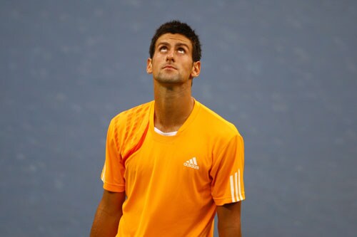 Novak Djokovic of Serbia reacts against Roger Federer of Switzerland during the men's singles semifinal match on day fourteen of the 2009 US Open in New York. (AFP Photo) US Open Day 14