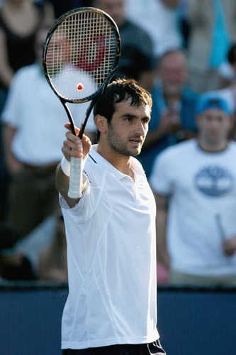 Florent Serra of France celebrates after his defeat against Janko Tipsarevic of Serbia during day two of the 2009 US Open at the USTA Billie Jean King National Tennis Center on September 1, 2009. (AFP Photo) US Open Day 2