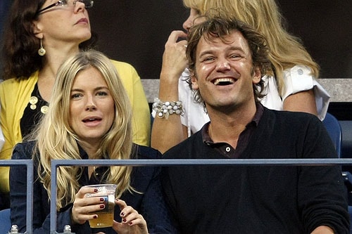 Actress Sienna Miller and DJ George Baker (a.k.a Slinky Wizard) attend the Venus Williams vs Magdalena Rybarikova of Slovakia match at the USTA Billie Jean King National Tennis Center in the Flushing neighborhood of the Queens borough of New York City. (AFP Photo) US Open Day 5