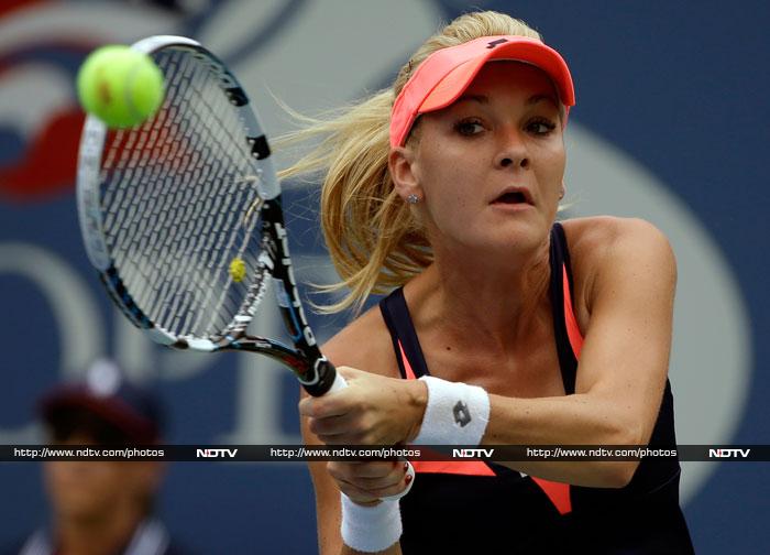 The first day saw business as usual among the women but the men lost two good prospects in Kei Nishikori and Bernard Tomic. (AP and AFP Photos) US Open Day 1: Radwanska, Li Na through, Nishikori bows out