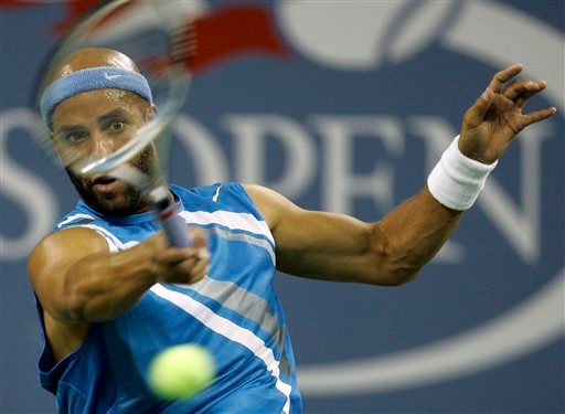 James Blake of the United States returns a shot to Stefan Koubek of Austria at the US Open tennis tournament in New York on Saturday. US Open - Day 6
