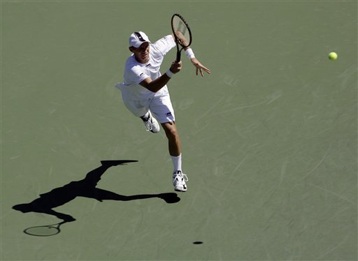 Nikolay Davydenko of Russia returns the ball to Nicolas Almagro of Spain at the US Open tennis tournament in New York on Saturday. US Open - Day 6