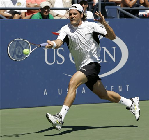 Tommy Haas of Germany chases a shot from Sebastien Grosjean of France at the US Open tennis tournament in New York on Saturday. US Open - Day 6