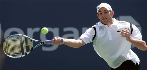 Andy Roddick of the United States returns a shot to Thomas Johansson of Sweden at the US Open tennis tournament in New York on Saturday. US Open - Day 6