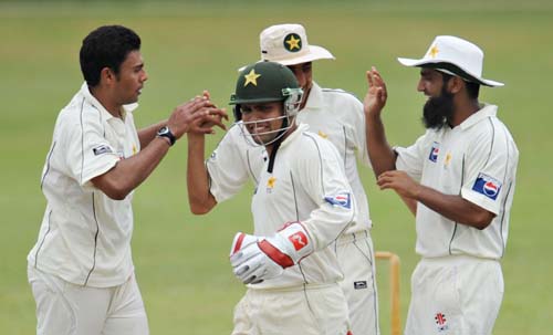 Danish Kaneria celebrates with teammates Kamran Akmal, Younus Khan and Mohammad Yousuf after the dismissal of Upul Tharanga during the first day of a three-day practice match between Pakistan and Sri Lanka Board XI in Colombo. (AFP Photo) Warm-up: PAK vs SL