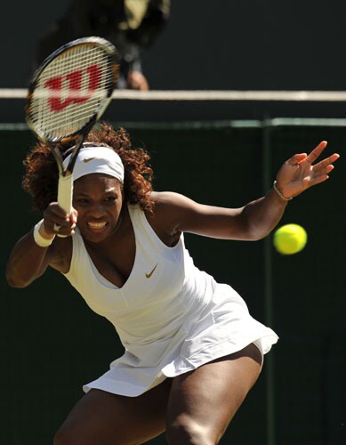 US' Serena Williams returns a ball to Australia's Jarmila Groth during their second round match at the All England Tennis Club on the third day of the Wimbledon. (AFP Photo) Wimbledon Day 3